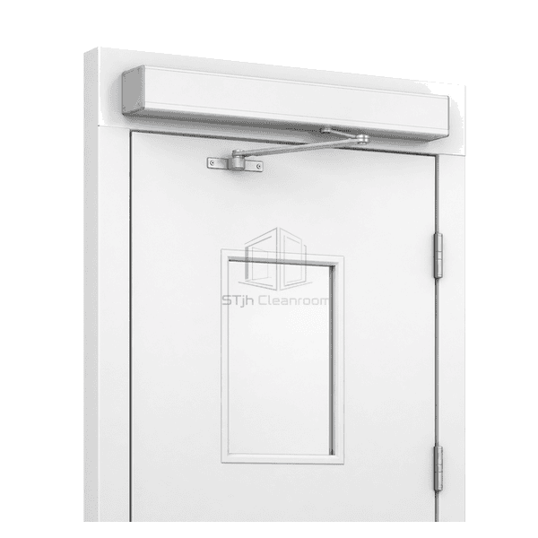 Automatic operator installed above a cleanroom swing door