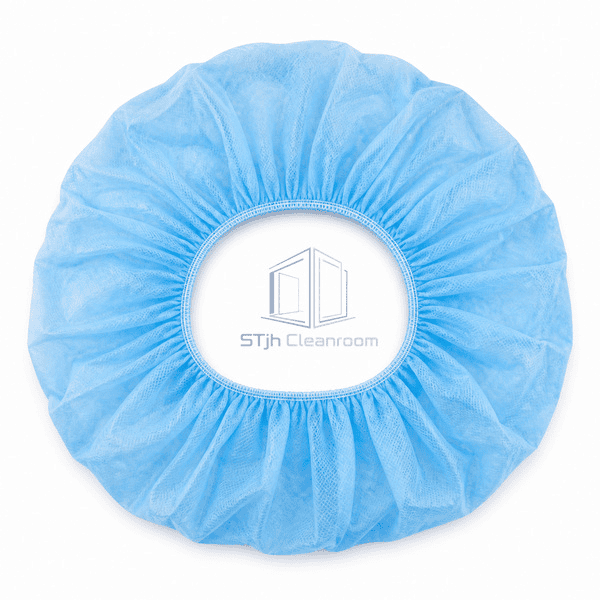 Blue bouffant cap front view showing gathered crown and elastic edge
