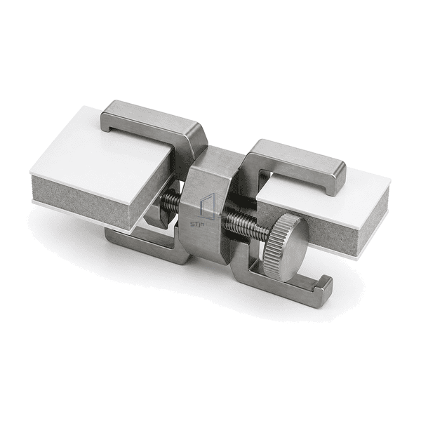 Horizontal alignment view of a removable clamp bridging two cleanroom panels