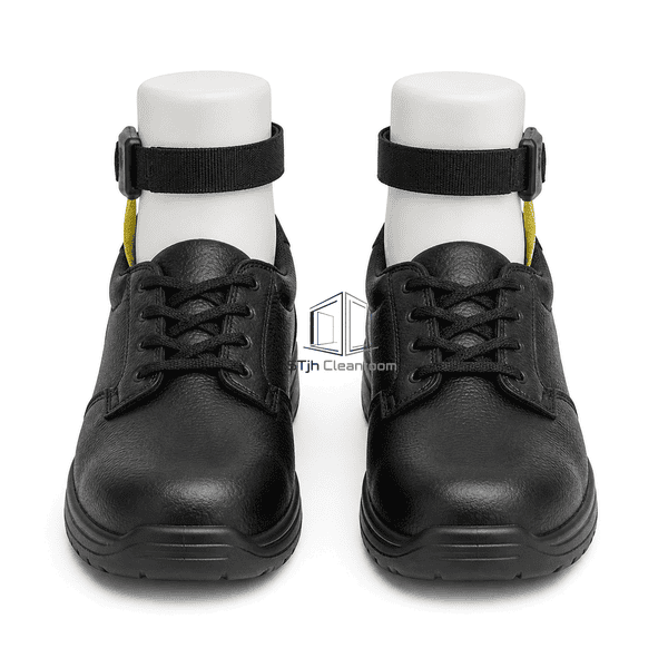Front view of paired ESD footwear grounders fitted to black work shoes