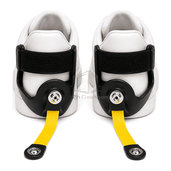 Front view of paired ESD heel grounders fitted to black work shoes