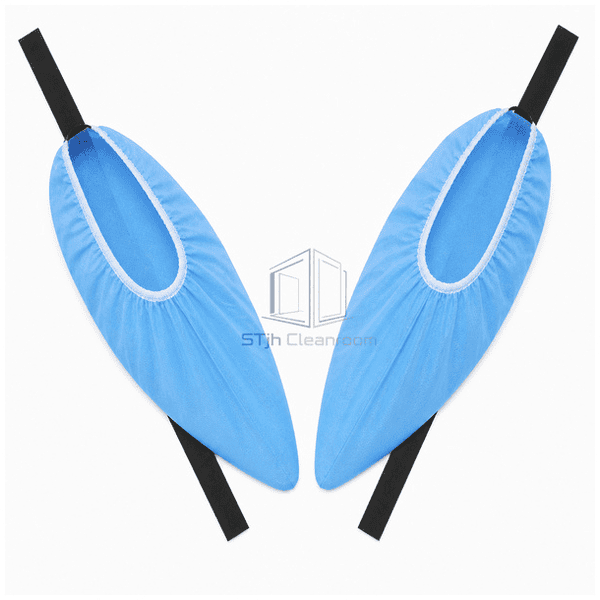 Blue ESD overshoes laid flat with conductive tapes extended