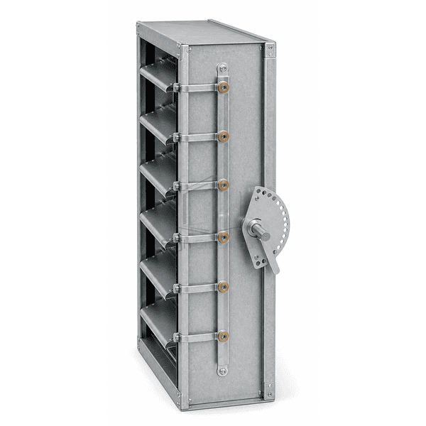 Side cutaway showing opposed blade shafts seals and channel frame
