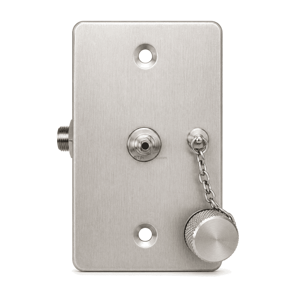 Near-front view showing two vertical mounting holes, central pressure nipple and tethered cap