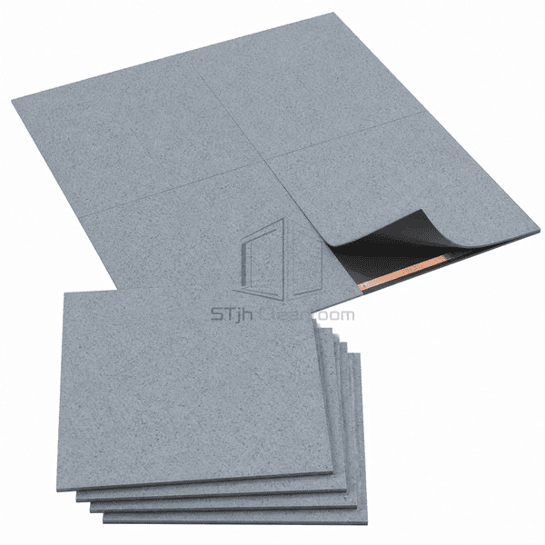 Stack of full static-dissipative flooring tiles beside assembled panel