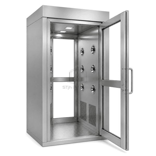 Interior hygiene detail showing satin stainless panels, a radiused corner and nozzles